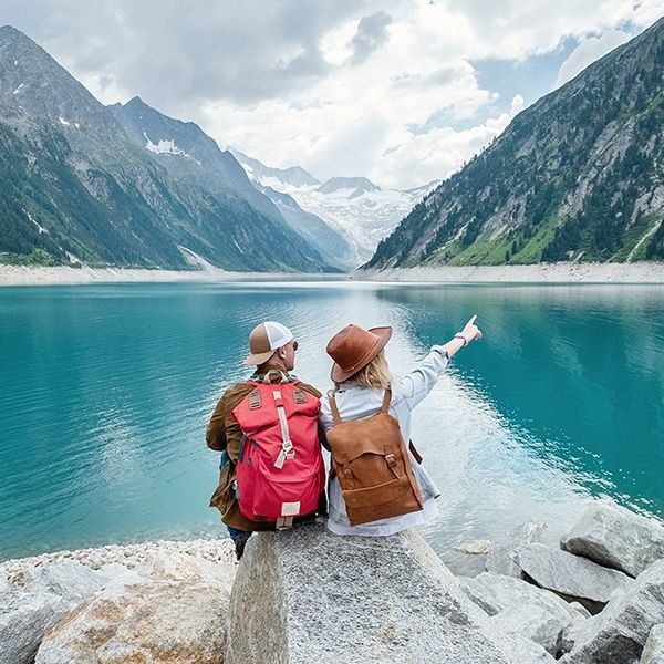 couple looking a lake taking an adventure vacation